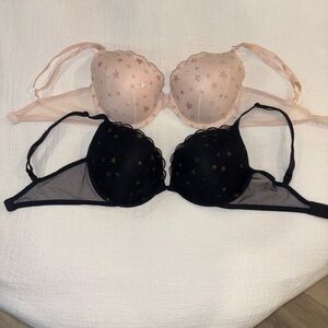 Two (2) Victorias Secret shimmery gold Star Patterned Black and Pink Bras 34DD